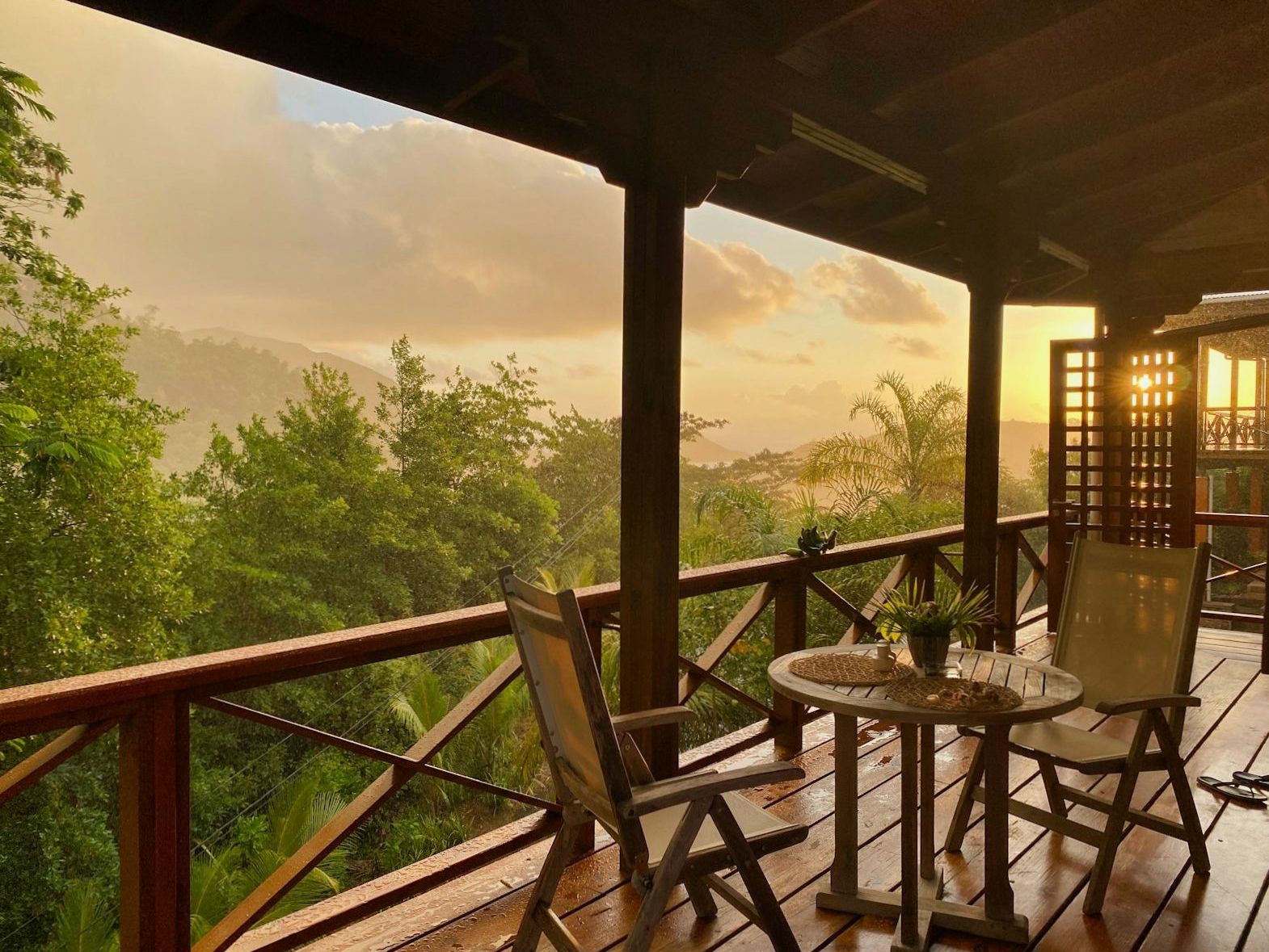 Timber terrace overlooking forested hills in late-evening light